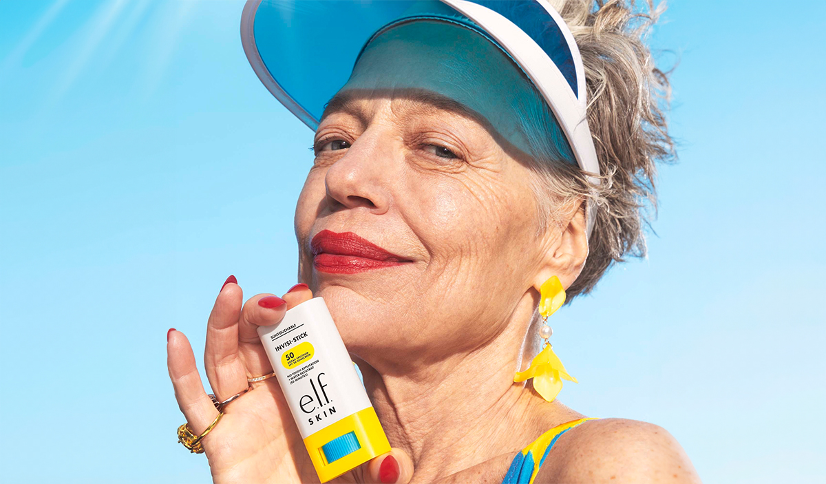 Model Holding Invisible Sunscreen Stick