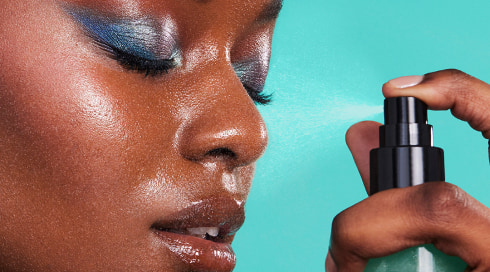 Spraying e.l.f. Power Grip Dewy Setting Spray