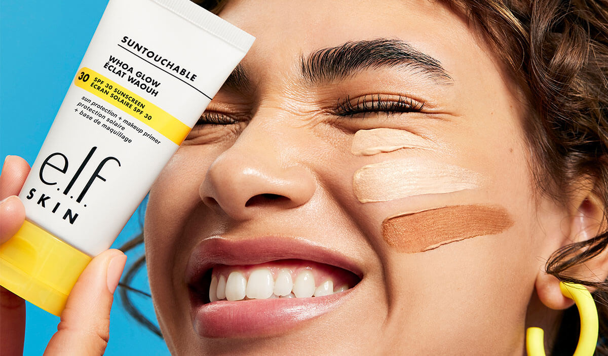 Someone smiling with e.l.f. SKIN Suntouchable sunscreen